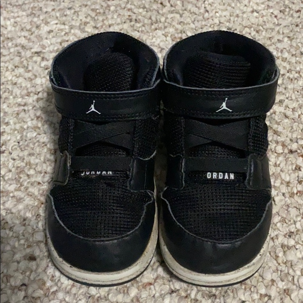 Jordan’s. Black and gray. High top. Velcro.